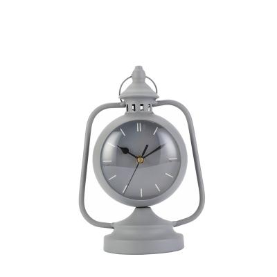 China Transitional Home Decor Alarm Clock Iron Case Round Quartz Desk Clock With Logo Customized for sale