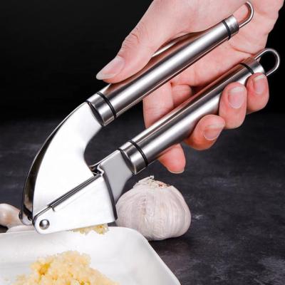 China Premium Stocked Stainless Steel Garlic Press includes a Garlic Peeler plus a Garlic Ginger Press, Crusher, Cleaning Brush Meat Grinder for sale