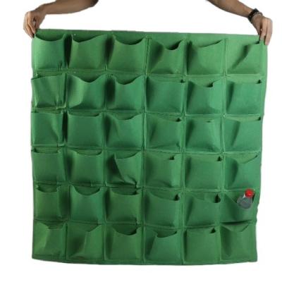 China Plant Growth 4/7/9/18/25/36/49/72 Pockets Garden Wall Hanging Planting Bags Green Plant Grow Planter Vertical vegetable Garden Grow Bags for sale