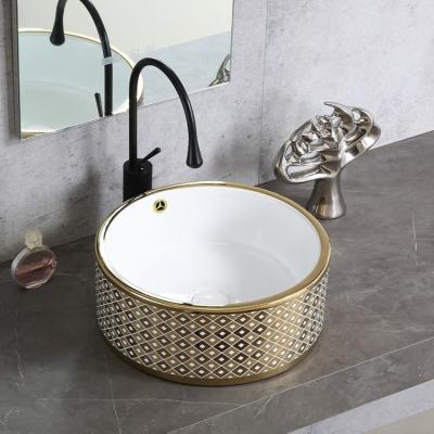 China Chaozhou Fancy Luxury Hotel Popular Home Decor Round Plated Gold And White Ceramic Table Top Bathroom Round Sink Art Hand Wash Basin for sale