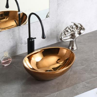 China Popular Luxury Bathroom Handrinse Sink Ceramic Gold Plated Art Wash Basin for sale