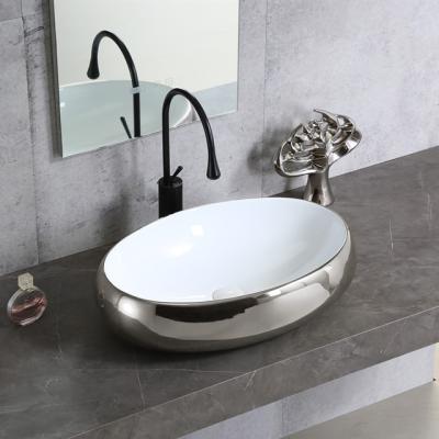 China Art Basin Face Hand Wash Modern Design Bathroom Popular Porcelain Countertop Oval Silver Plating Ceramic Sink for sale