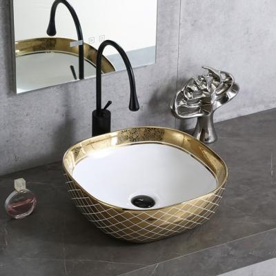 China China Wholesale Popular Ceramic New Design Hotel Round Wash Basin Countertop White Electroplate Bathroom Sink Hand Wash Art Basin for sale