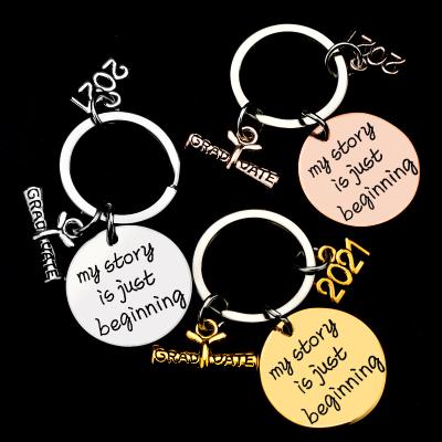 China Metal Class of 2021 Graduate Gift My Story Just Begins Round Charm 2021 Graduation Stainless Steel Cavity Disc Key Chain for sale