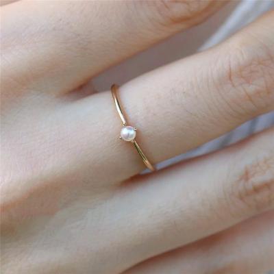 China TRENDY Simple 4mm White Pearl Women Rings Shiny 14k Gold Plated Fine Circle Ring for sale