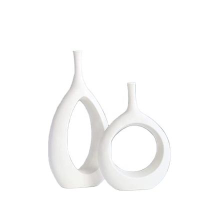 China All Handmade Modern Nordic Geometric Decoration White Ceramic Cavity Vase Oval Set Of 2 Flower Vase For Living Room for sale