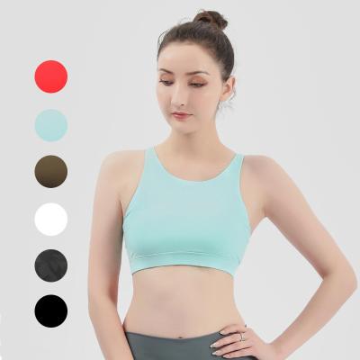 China Wholesale New Women Sport Solid Color Hot Sexy Betrayal Straps Breathable Gather Top Fitness Yoga Training Bra for sale