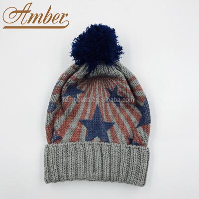 China Custom Stripes Stars Printing Children's Winter Knitted Beanie Hat with Pompom Te koop