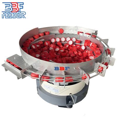 China Conveyor System Cap Bowl Feeder Crown Lids Flip Top Cap Vibrating Lineaire Feeder Te koop