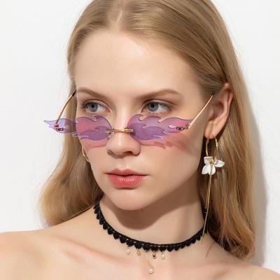 China Newest Fashion Sunglasses Designer Customized Fire Rimless Frame Trend Coin Photo Widespread Sunglasses For Woman Man for sale