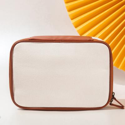 China Custom Logo Canvas Cosmetic Bag Dustproof Bag Fashion Trendy Design Canvas Makeup Bag for sale