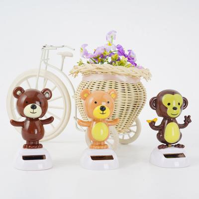 China Custom Solar Power Anime Figurines Decor Animals Support Rabbit Dog Cat Car Dashboard Solar Toys for sale