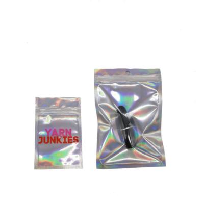 China Eco Friendly Customizable Holographic Packaging Bags Pink Zipper Moisture Proof Holographic Colorful Packaging Bags for sale