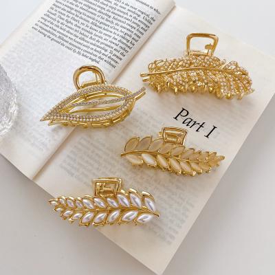 China New Environment-Friendly Korean CIA Hair Clips Amazon Alloy Leaf Shape Hair Claws Bead Crystal Claw Hair Clips For Women for sale