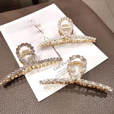 China New Environmentally Friendly CIA Alloy Hair Claw Amazon Cuts 11 Cm Pearl Crystal Crossed Hair Claws For Women for sale