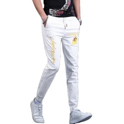 China Men's new breathable summer jeans fashion ironed drill embroidery printing leisure small foot elastic thin pants for sale