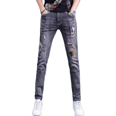 China Breathable jeans men spring and thin pants men summer embroidery new brand stretch hole gray men's pants for sale