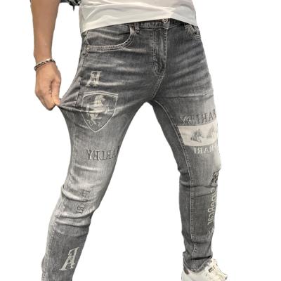 China Summer Fashion European Men's Breathable Pants Printed Slimming Ironed Drilling Washed Slim Stretch Jeans Men's Trousers for sale