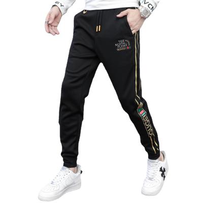 China 2021 Autumn Fashion Slim Fit Anti-Wrinkle Pants Striped Jogger Pants Mens Floral Footprint Casual Pants for sale