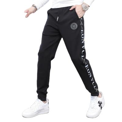 China Anti-wrinkle new autumn 2021 casual pants men's trend personalized side lettered striped footband youth sports pants for sale