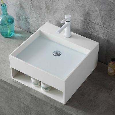 China Modern LUXSPA Acrylic solid surface wash basin bathroom wall mounted hand wash basin for sale