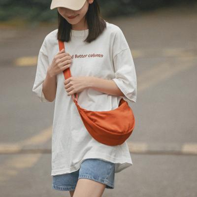 China Durable Popular Retro Nylon Canvas Messenger One Shoulder Solid Color Lightweight Dumpling Bags For Women for sale