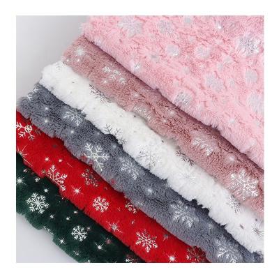 China Abrasion-Resistant Wholesale PV velvet hot stamping snowflake fabric plush polyester Soft for Christmas decoration clothing pillows toys Blankets for sale