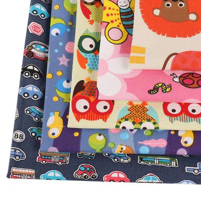 China Shrink-Resistant Wholesale Cartoon printed canvas fabric 10oz polyester cotton Animated patterns canvas for tablecloths sofas picnic mats Luggage for sale