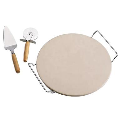 China Amazon viable hot selling set of 3 pieces 13 inch ceramic round pizza stone with pizza wheel cutter and serving rack for sale