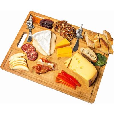 China Kitchen Household Bamboo Cutting Board Sustainable Carbonized Fruit Bread Cheese Oatmeal Multifaceted Cutting Board for sale