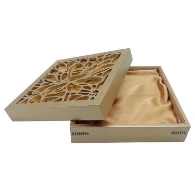 China Recycled Materials Square Hollow Out Wooden Jewelry Packaging Box In Gold Color for sale