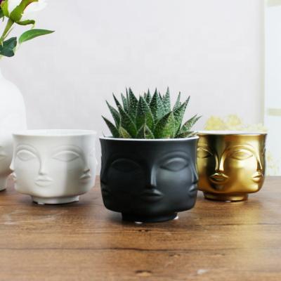 China Nordic minimalist human face small vase decoration ceramic vase custom made for furniture face sculpture home vase for sale