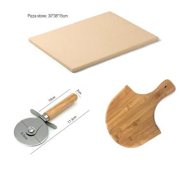 China Stored Rectangle Cordierite Bread Pizza Stone Set With Bamboo Pizza Cutter Paddle for sale