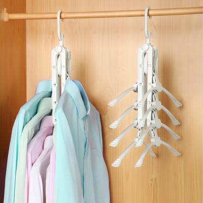 China Eco-friendly Multifunctional Cloth Stand Foldable Plastic Space Saving Clothes Hanger Magic Hanger for sale