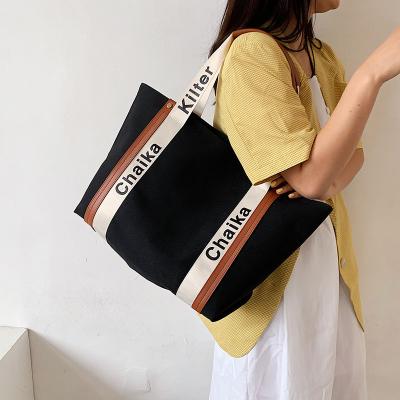 China New Large Capacity Women's Canvas Summer Portable Handbag Fashionable Girl's Tote Bag College Armpit Purchasing Style en venta