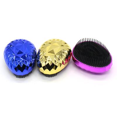 China Handheld 4g Color Shine Cover Easter Egg Design Mini Plated Shape Detangle Hairbrush for sale