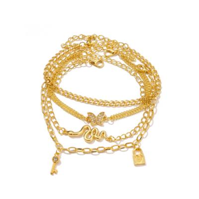 China FASHIONABLE Hot Selling 4Pcs/Set Gold Plated Anklets With Charm Snake Butterfly Lock Key Pendants Anklets Love Jewelry Gifts for sale