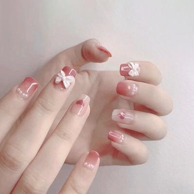 China DIY nail art X36 3d art medium faux bow ballet pink press on nails new design style faux nail back glue for sale