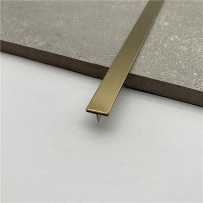 China Modern Shiny Brass Metal T Shaped Strips Floor Cover Strip Chrome Stainless Steel Trims Floor Grade 304 Stainless Steel Trim for sale