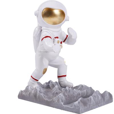 China Small Mobile Phone Stand Astronaut Desktop Decoration Student Desktop Holder Cute Mobile Phone Astronaut Handmade Simple Creative Gift for sale