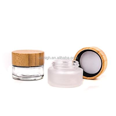 China Wholesale Cosmetic Airtight Glass Jars With Bamboo Lids Customize Frosted Glass Cosmetic Packaging Jars for sale