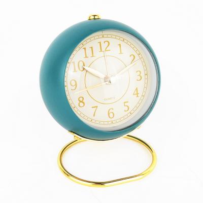 China Arched Glass Lens Special Shape Clocks Watches Metal Wholesale Luxury Table Analog Alarm Clock for sale