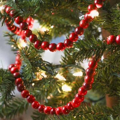 China 100% Handmade High Quality Wooden Beads For Christmas Tree Ornaments Red Wood Bead Garland Wall Hanging Decor 2021 for sale