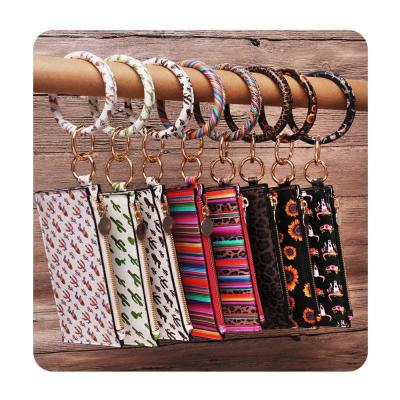 China PU Leather Bracelet Key Chain Hot Sale Personalized Designs Charms Floral Leather O Ring Bag Bangle Keychain Set PU for sale