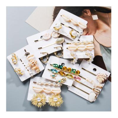 China Hair Clip Set For Girl's Gold Wholesale Korean Shell Hairpin Pearl Freshwater Cowrie Hairclip Set For Girls for sale