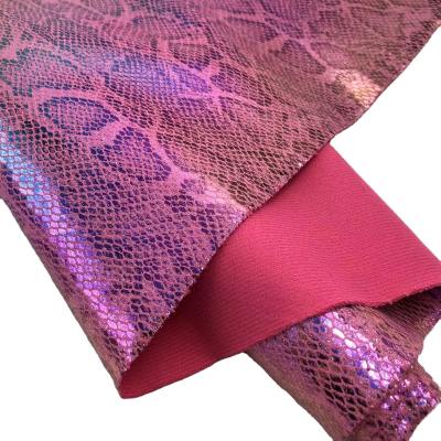 China FA-611-Holographic Transfer Foil Rainbow Glitter Polyester Waterproof Snake Scales Glitter Fabric For Shoes Bag Opening Belt DIY for sale