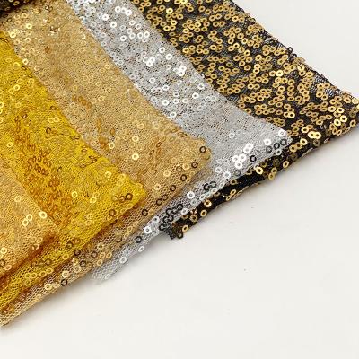 China Breathable Luxury Iridescent Yellow Net Tailoring Multicolor Metallic Sequin Gold Lace Mesh Sequin Fabric for sale