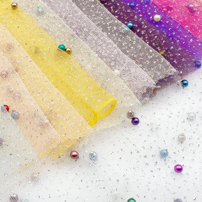 China Latest Breathable Polyester Metallic Glitter Tulle Festival Novelty Festival Kids Clothing Colorful Blended 100% Beads Fabric for sale