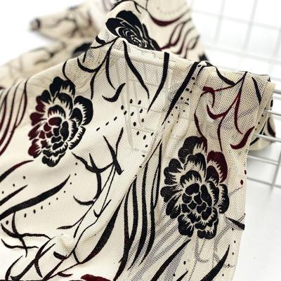 China Two Tone Polyester 100 Polyester Mesh Pure Soft Stretch Black Red Flower Flocked Fabric for sale