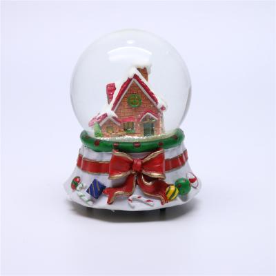 China Europe Custom Christmas Snow Globe With Cartoon House / Promotional Glass Snow Globe for sale